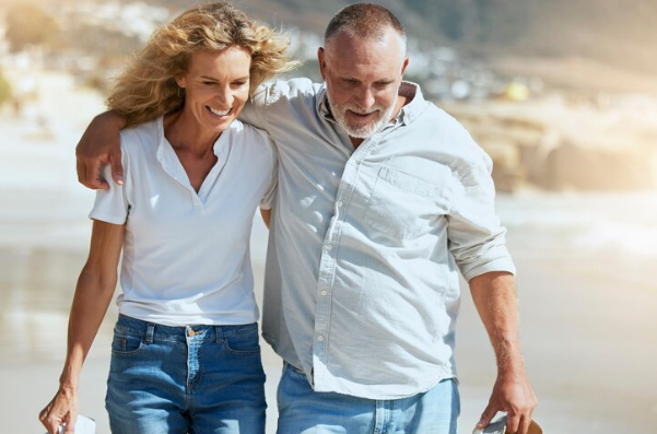 guilford beach of couple walking